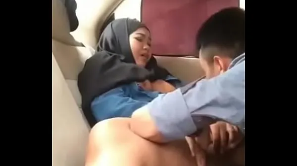 HD Hijab girl in car with boyfriend drive Clips